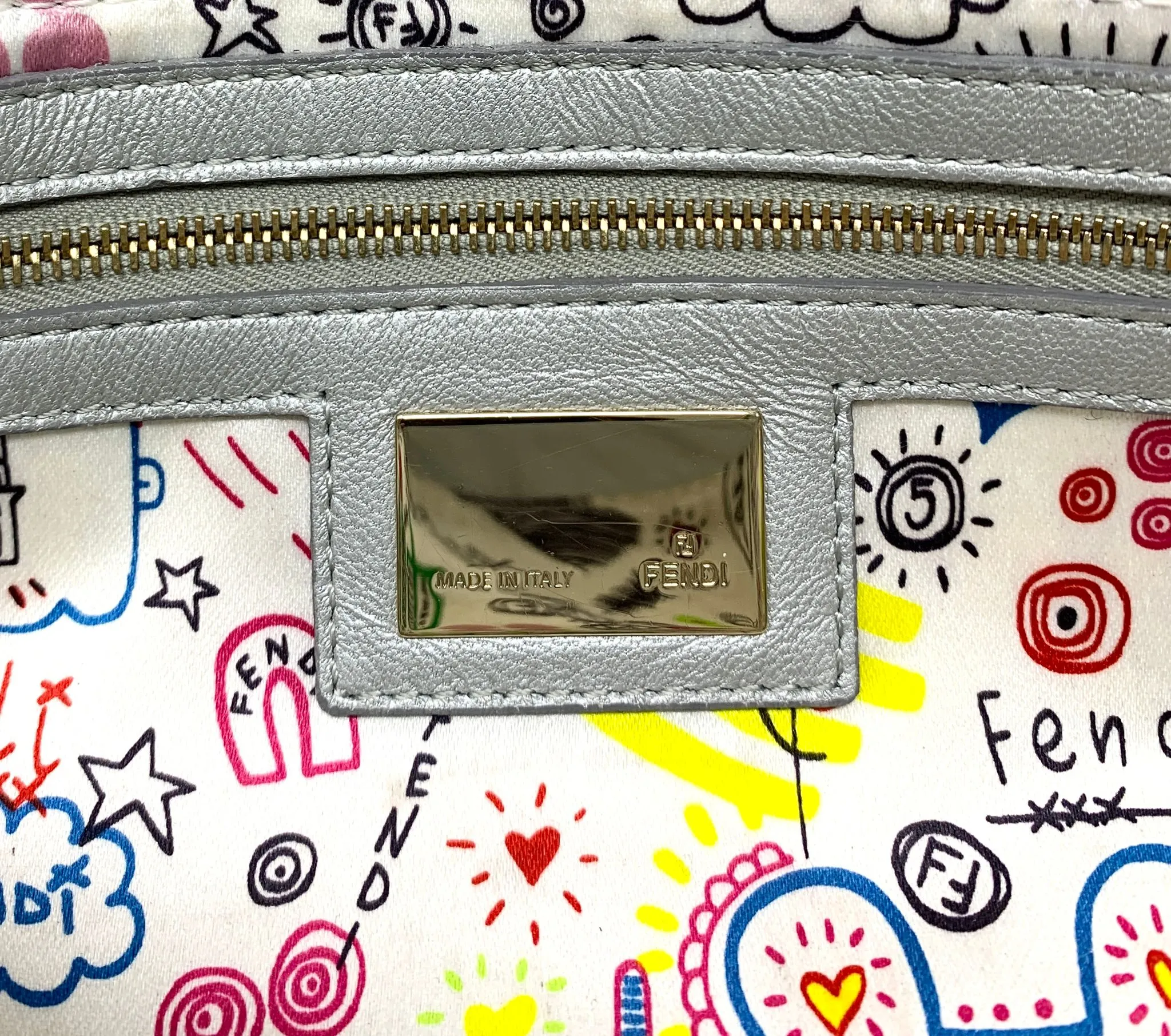 Fendi Silver Embossed Logo Baguette Bag
