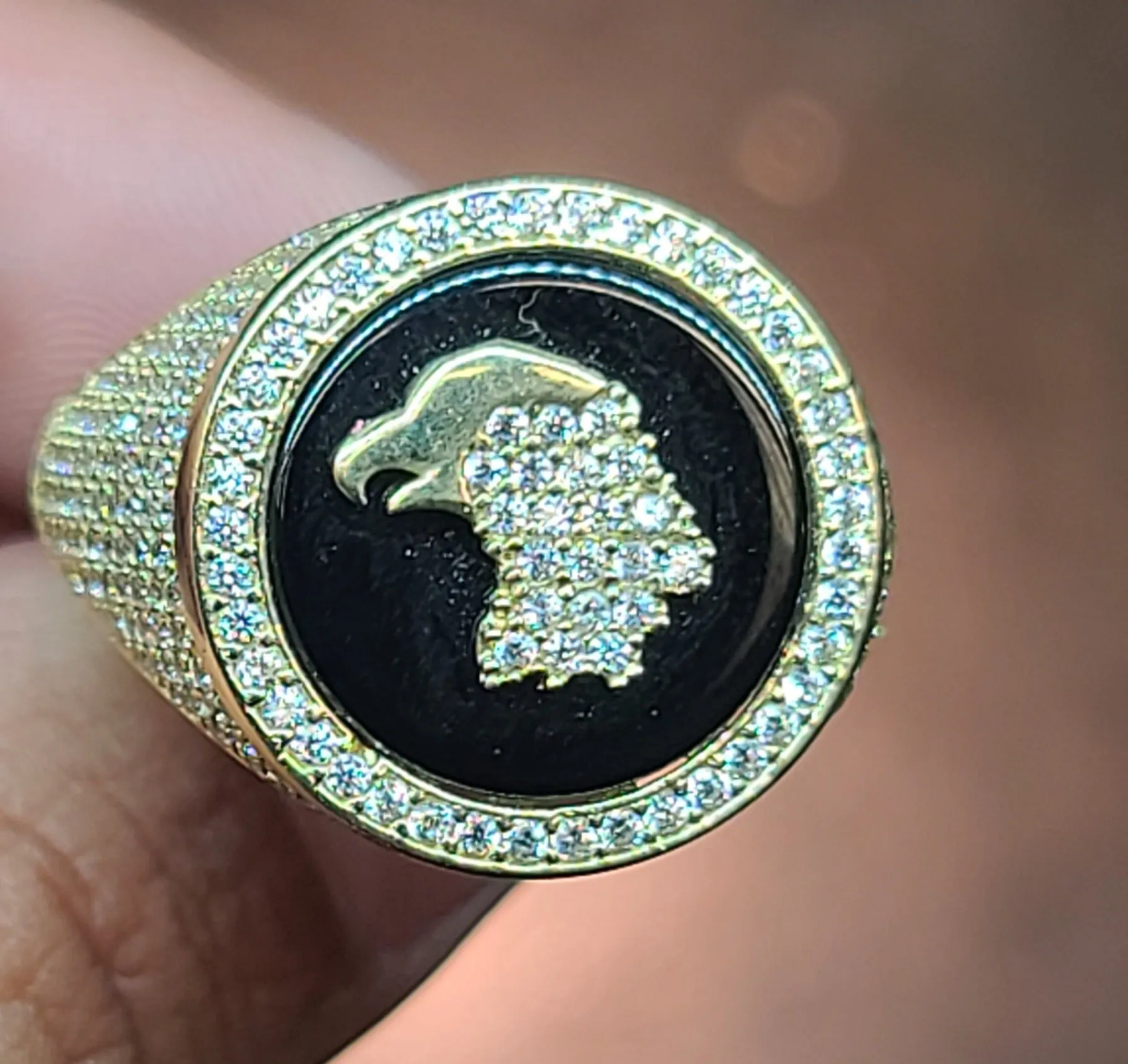 Yellow Gold Circular Ring With Reflective Background and Bird
